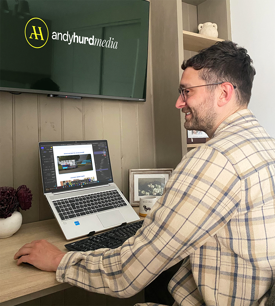 Andy working at a desk on a branding project